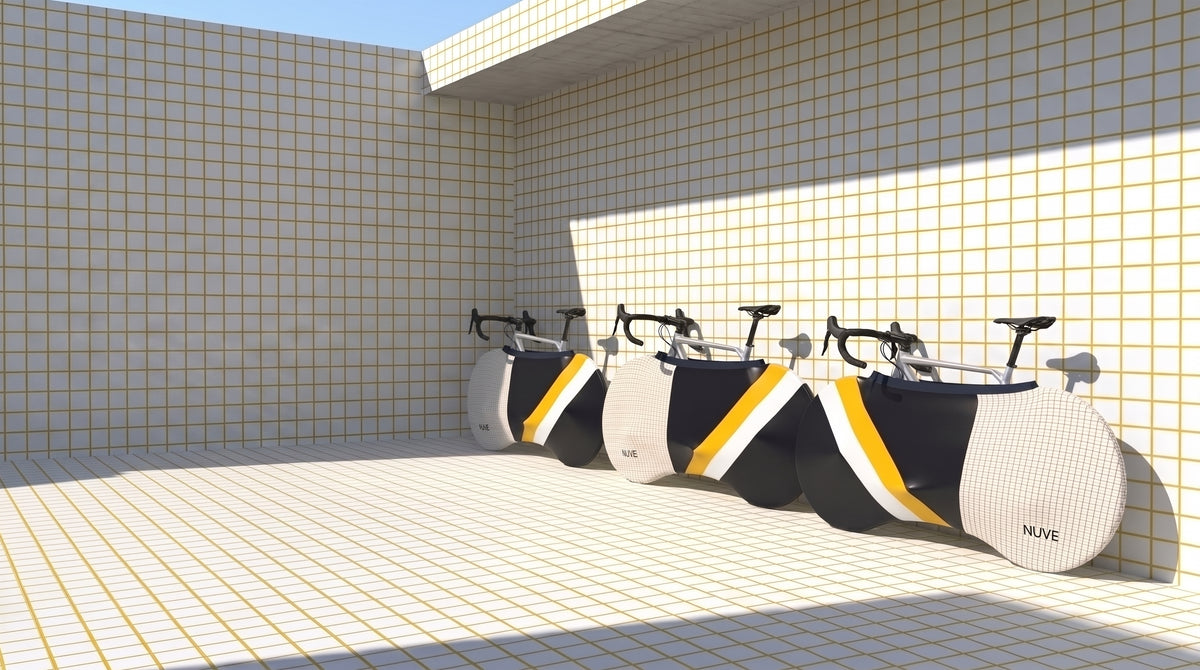 NX2 bicycle enclosure in Hackney Plaid colourway, blue navy and yellow two-tone, in a white tile architectural background.
