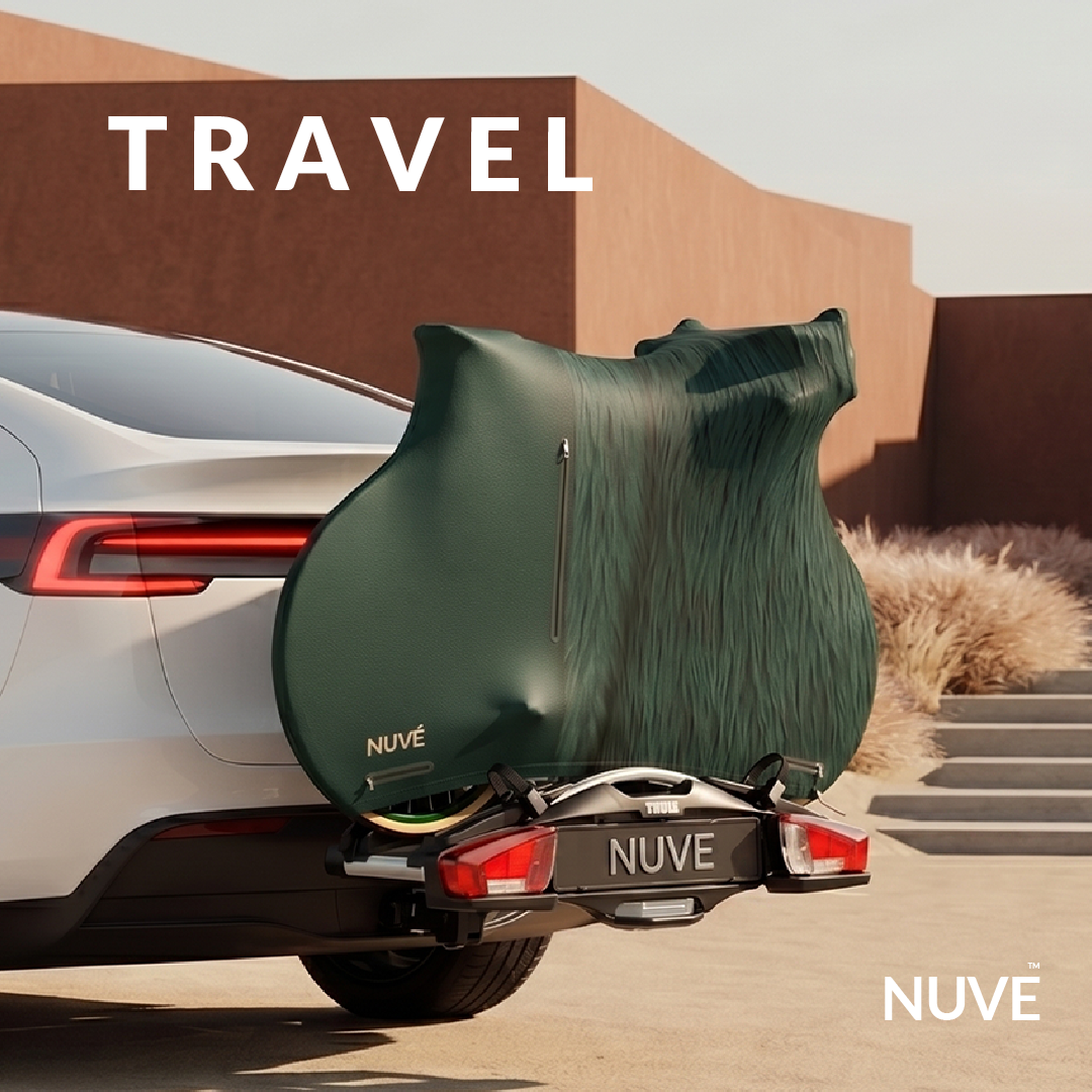 Nuve NX1 protective gear in Mayfair Fur colour range, dark green leather and Fur, mounted in a car rack in a terracotta architectural background.